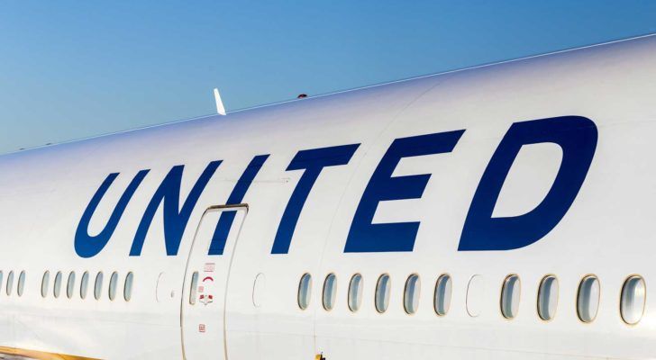 the side of a united airlines (UAL) plane with &quot;united&quot; written above passenger windows