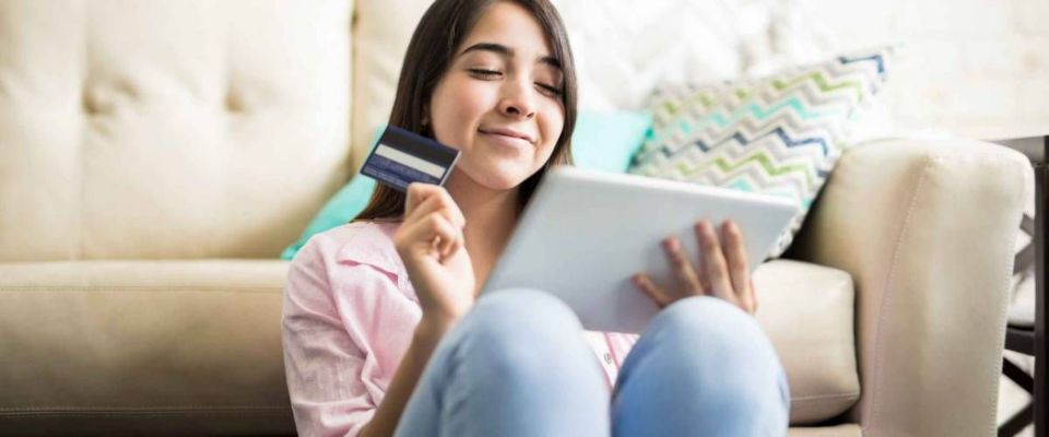 Young woman excited about shopping online