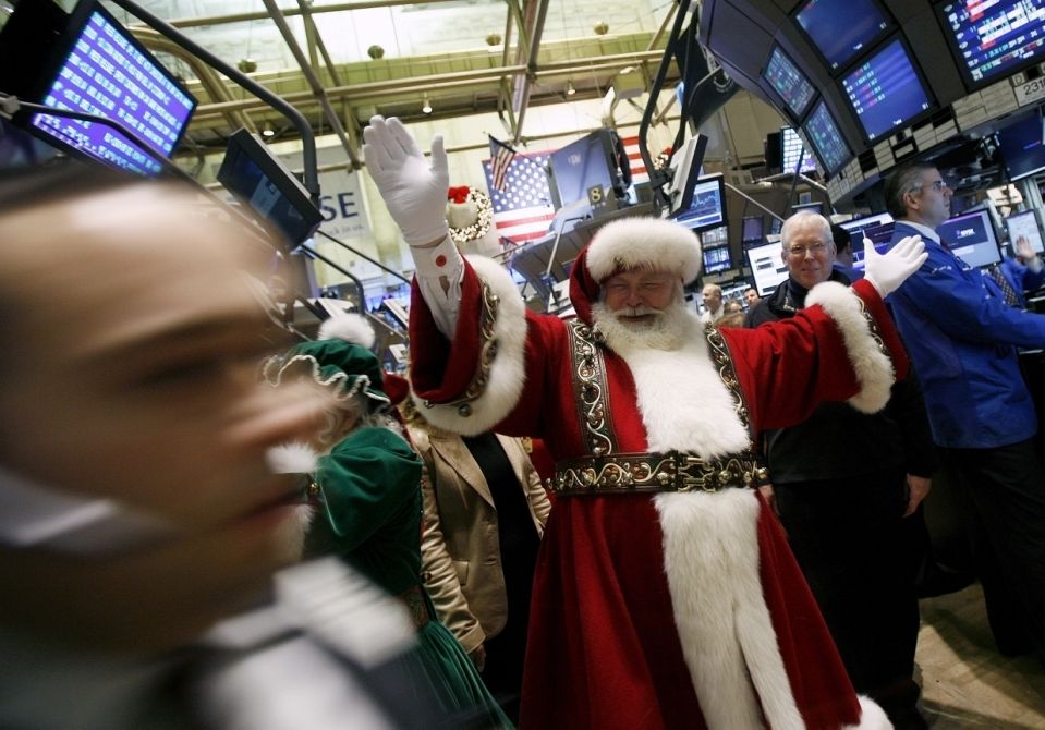 A man dressed as Santa Claus walks the floor of the New York Stock Exchange, November 24, 2008. U.S. stocks rose further on Monday after data showed U.S. existing-home sales fell in October about in line with expectations, adding to earlier gains on the government's $20 billion injection of new capital into Citigroup.    REUTERS/Shannon Stapleton (UNITED STATES)