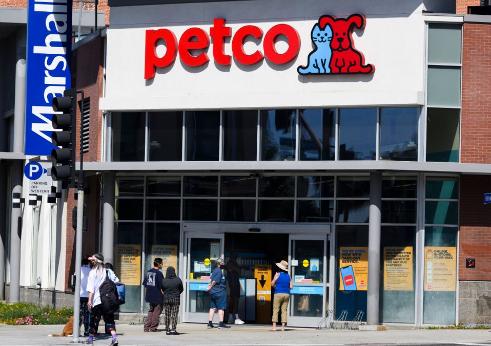 Shoppers wait in a line outside a Petco pet store in Hollywood, California, on April 23, 2020 during the novel coronavirus pandemic. (Photo by Robyn Beck / AFP) (Photo by ROBYN BECK/AFP via Getty Images)