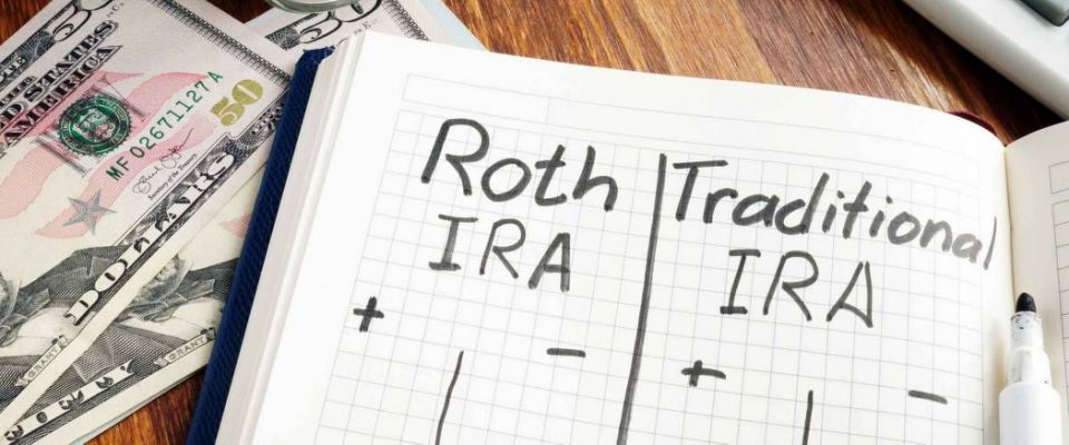 Roth IRA vs Traditional IRA written in the notepad.