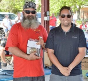 Pictured: 1st place winner in the chicken halves category, Chris Davis with Crossed Rifles BBQ JOE DAVID CORDOVA | PLEASANTON EXPRESS
